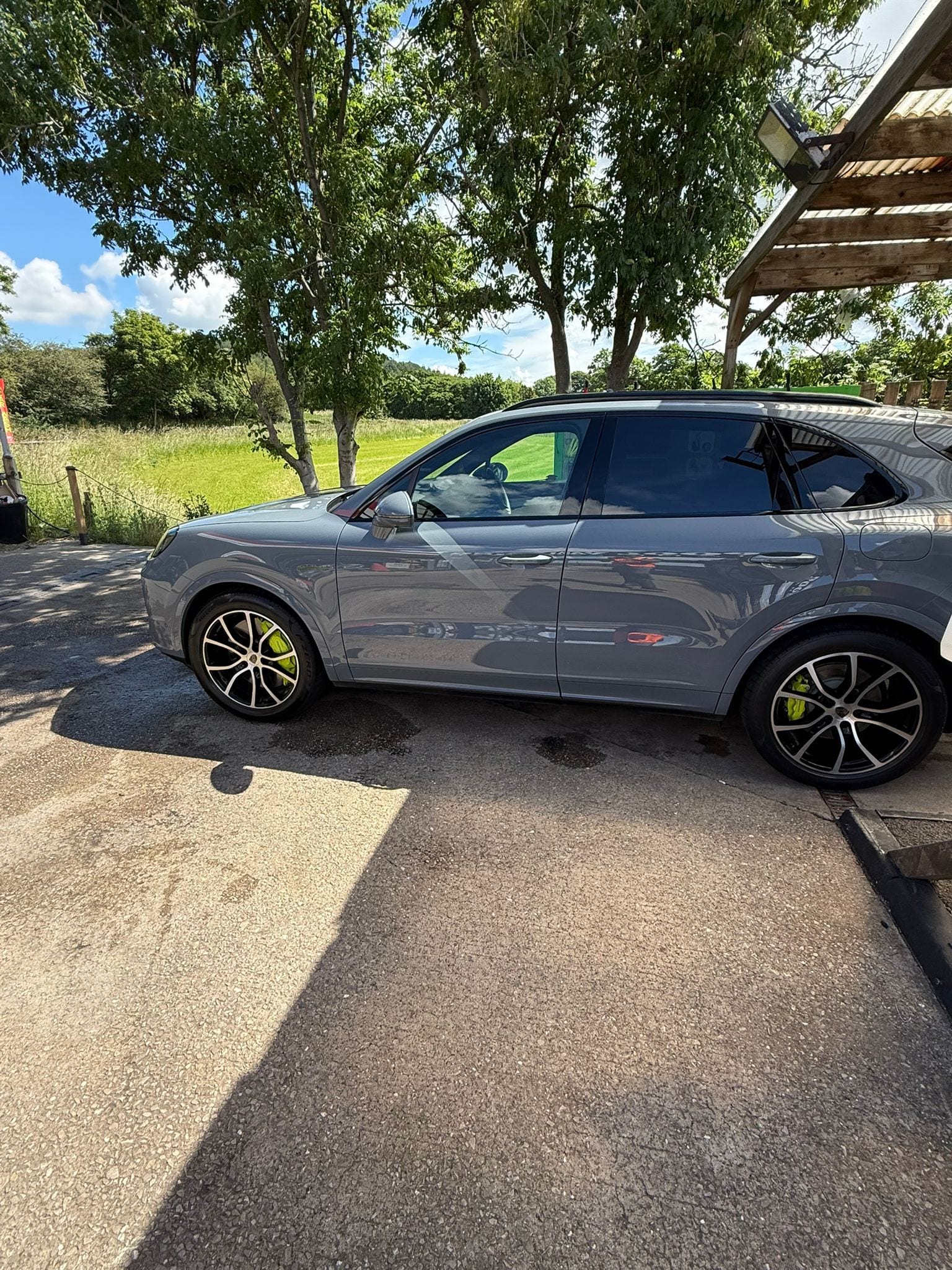 Grey Porsche Cayenne valeted, gleaming in the sun