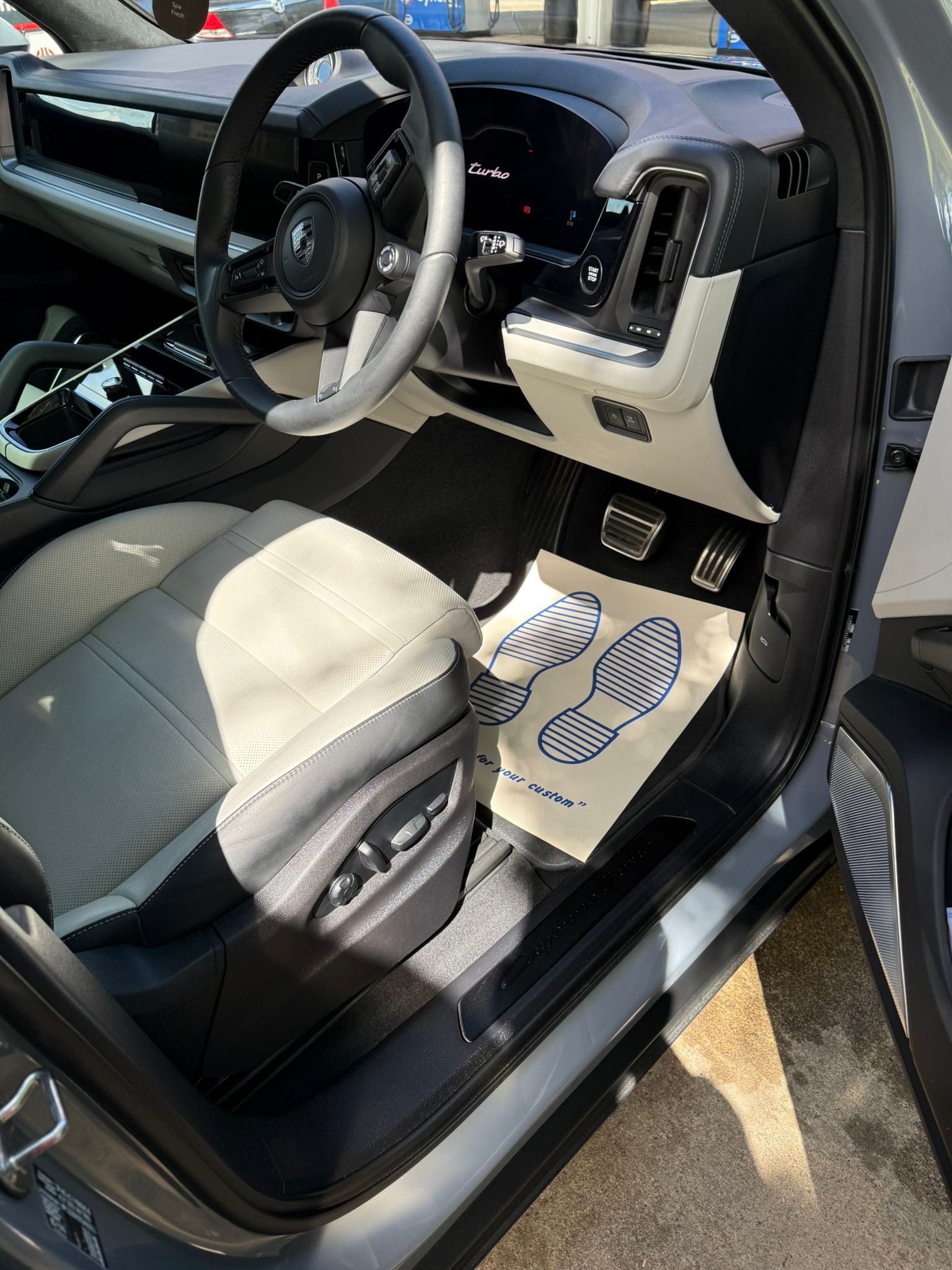 Spotless car interior with cream leather seats